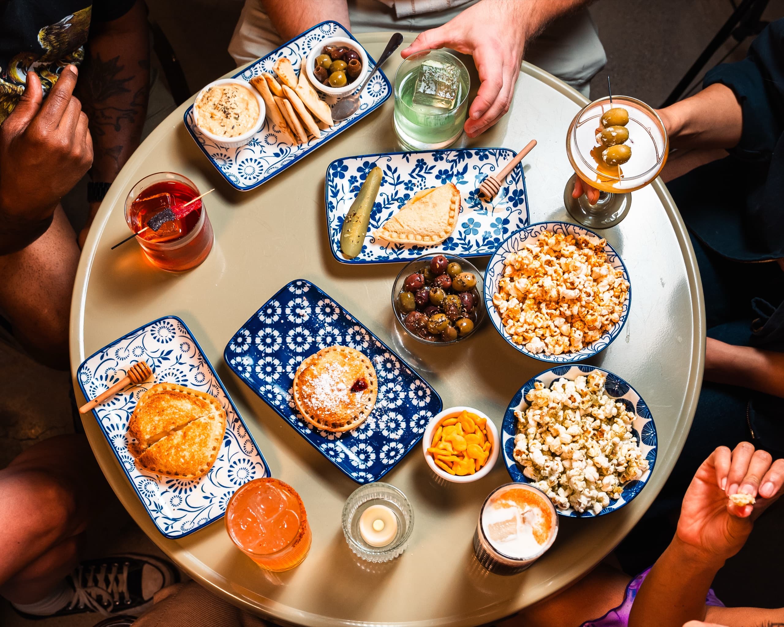 Overhead view of cocktails and small plates at Pals