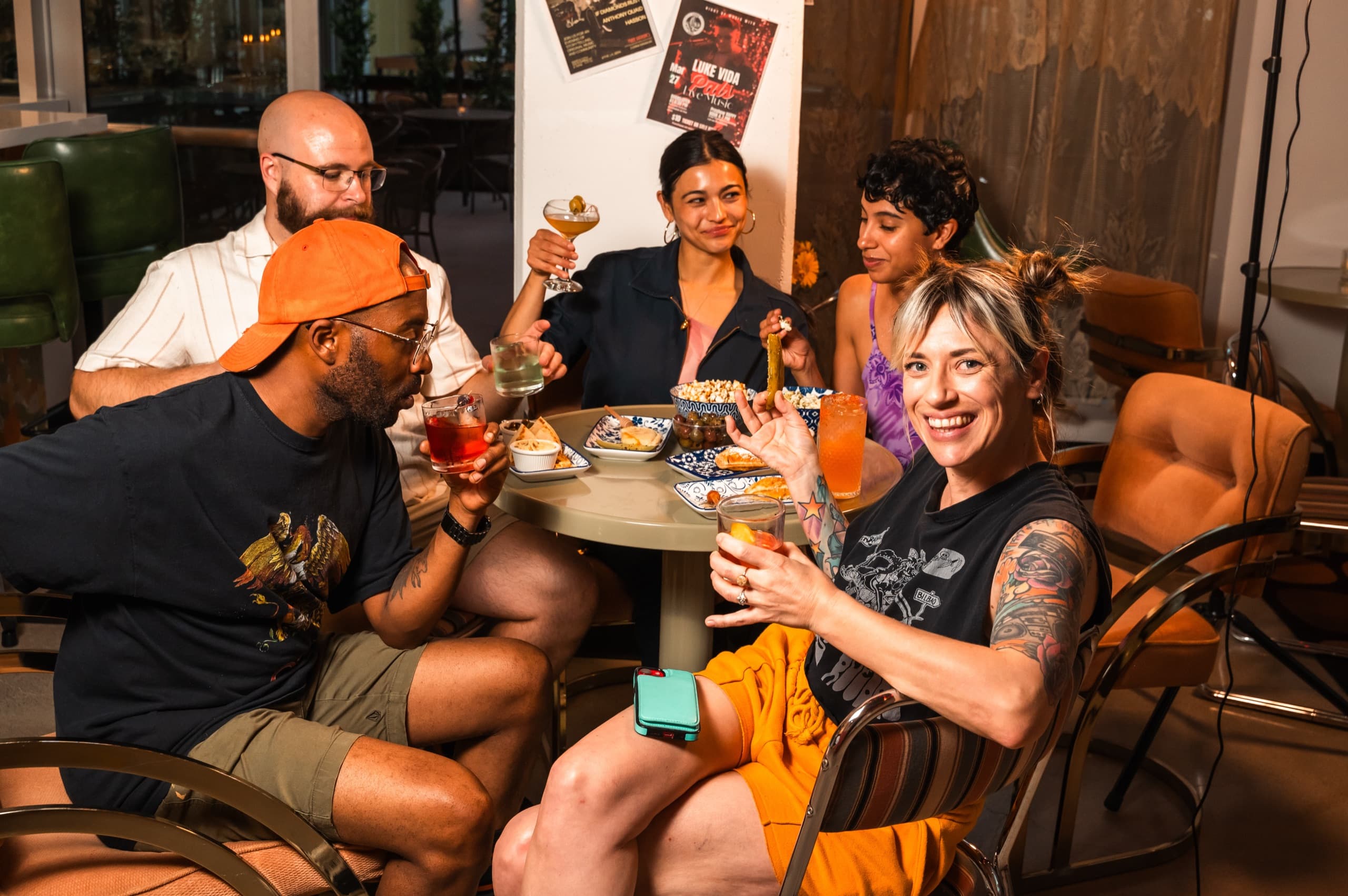 Friends enjoying drinks and food at Pals