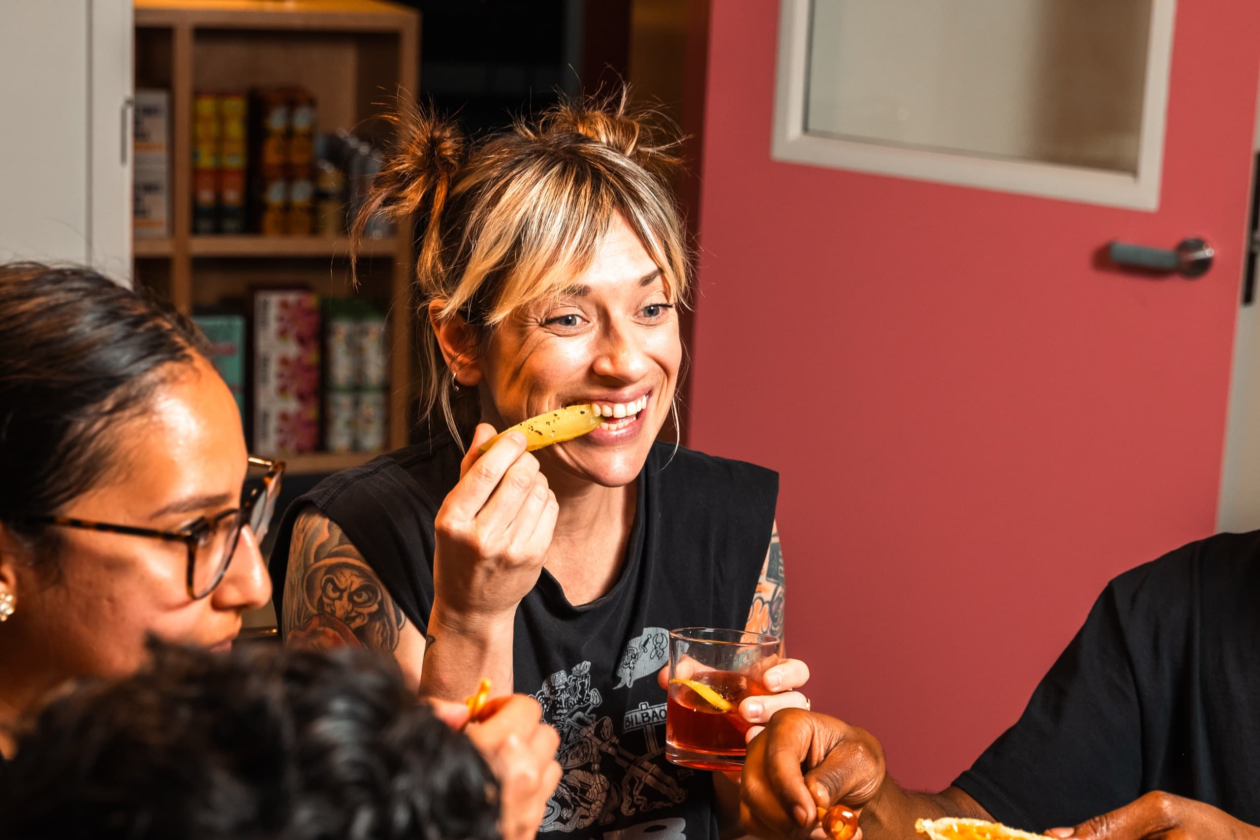 Guest enjoying pickles and drinks at the bar
